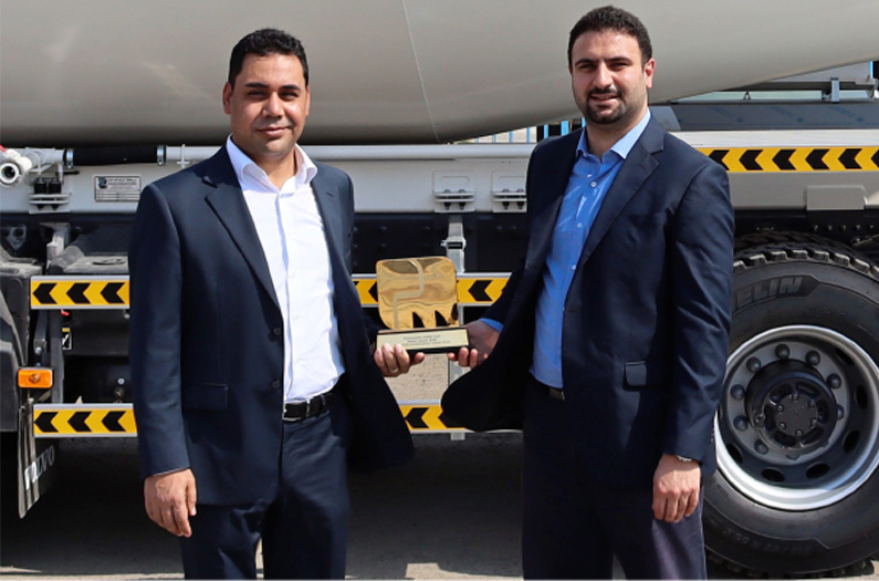 Basim Elmelegy, product manager, Zahid Industries, and Alaa Akra, general manager, Zahid Industries, with the Putzmeister Dealer Award.